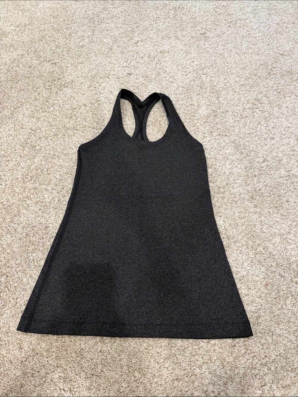 Lululemon size 6 Racerback Tank Top. Dark gray Worn once looks/feels brand new.
